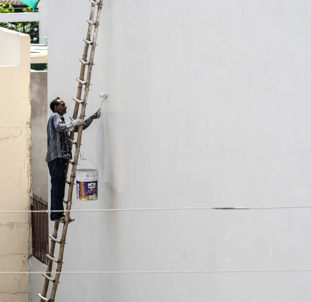 Painter & wall repair — at work (illustrative photo)